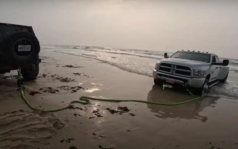 Ram 3500 needs towing after being stranded on beach